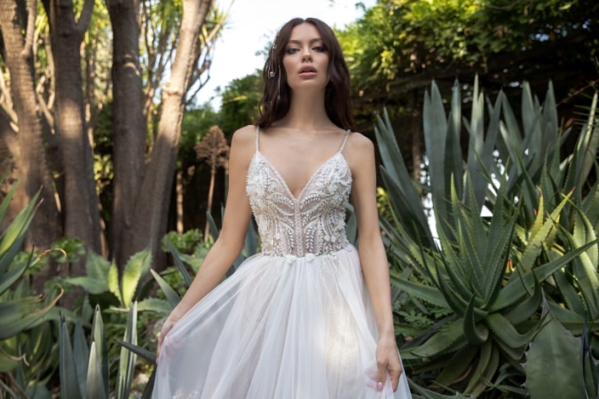 Model in a beaded spaghetti strap wedding dress