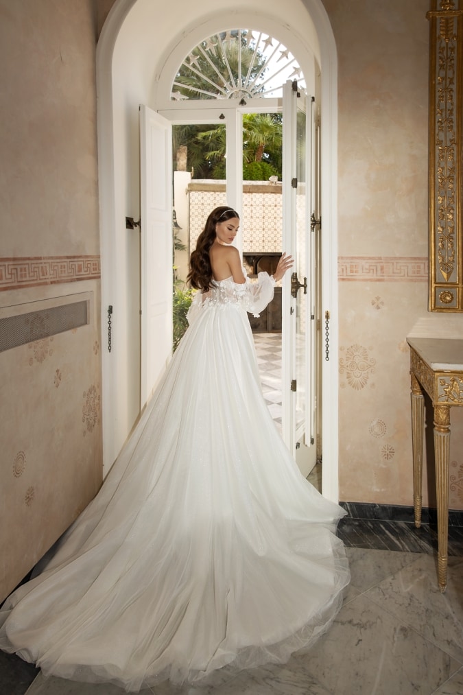 Gorgeous bridal gown with long tulle train cape